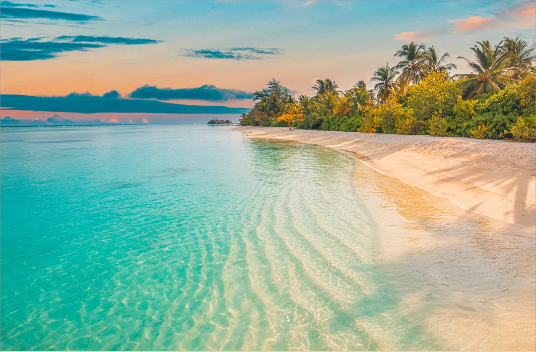 crystal clear water hitting a beautiful beach