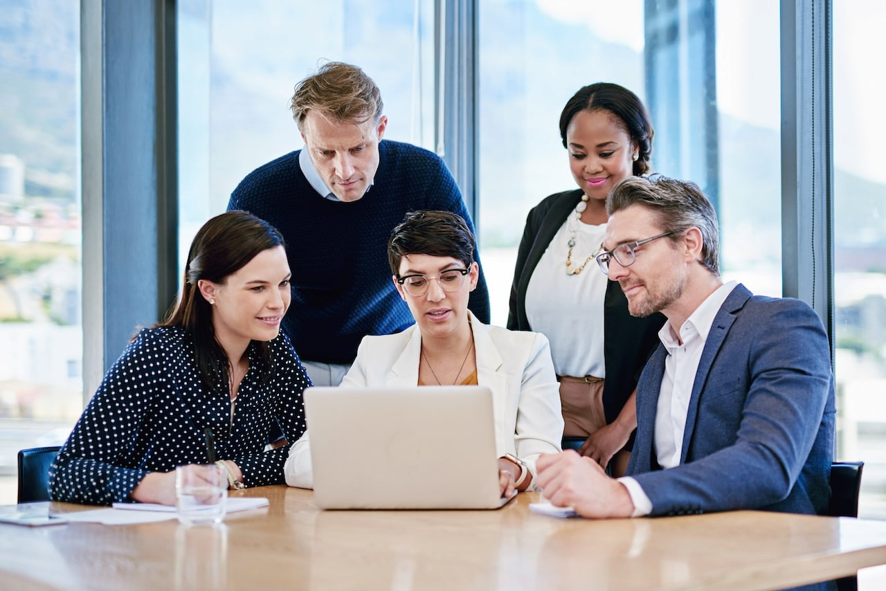 corporate meeting with five staff